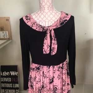 Pink and black Disney dress with Alice in Wonderland print.